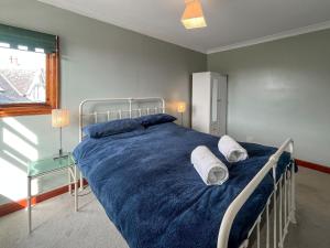 a bedroom with a bed with two pillows on it at Avocet Apartment - Uk51130 in Carradale