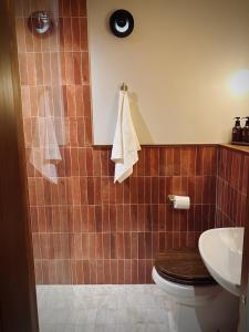 a bathroom with a toilet and a sink at Margate Manor - Rooms by the Sea in Margate