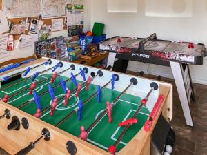 a table with a snooker game in a classroom at Cider Cottage - Uk11861 in North Tamerton