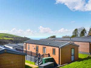 a tiny house with a view of the ocean at Lodge 33 in Woolacombe
