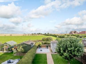 an overhead view of a garden with a greenhouse at White Stag Cottage in Bamburgh +12 photos