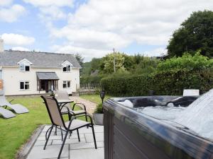 a patio with chairs and a water fountain at Herrock View in Evenjobb +7 photos