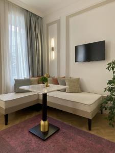 a living room with a couch and a table at Nuo Taksim Rooms in Istanbul