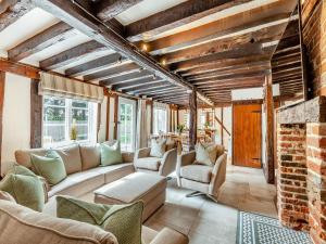 a living room with a couch and a fireplace at The Cottage in Broomfield