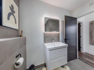 a white bathroom with a sink and a shower at Lligwy Lodge 3 - Uk42793 in Llangefni +5 photos