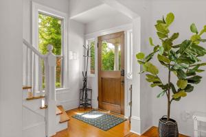 a hallway with a door and a potted plant at Latourette Estate in McMinnville