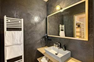 a bathroom with a sink and a mirror at Archerhof in Racines +64 photos