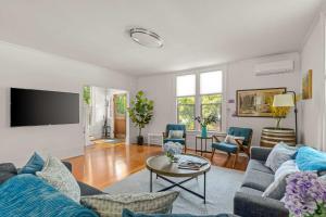 a living room with a couch and a table at Latourette Estate in McMinnville +44 photos
