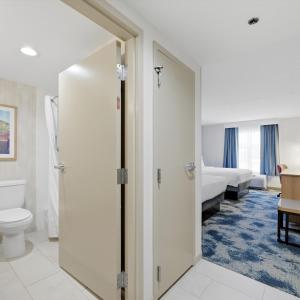 a room with a bathroom with a toilet and a bed at Hampton Inn Inwood in Inwood +72 photos