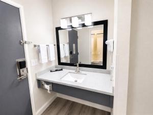 a bathroom with a sink and a mirror at Blaine Town Inn & Suites in Blaine +76 photos