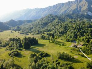 an aerial view of a field with mountains in the background at BONIS - Nidi nel Bosco in Montemaggiore +26 photos
