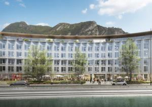an architectural rendering of a building with mountains in the background at Ysotop Hôtel Grenoble in Grenoble