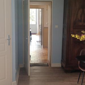 a hallway with a door leading into a room at Escale en sud Charente in Chavenat