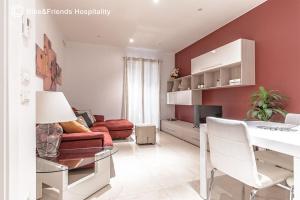 a living room with a couch and a table at Dimora San Francesco in Pesaro