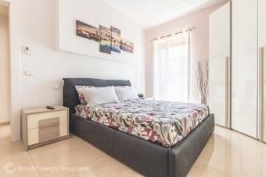 a bedroom with a bed and a table in it at Dimora San Francesco in Pesaro