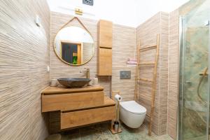 a bathroom with a sink and a mirror at Apartman Miriam in Opatija +4 photos