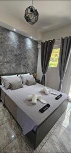 a bedroom with a large bed in a room at Alma-Libre house 2 in Kefalos