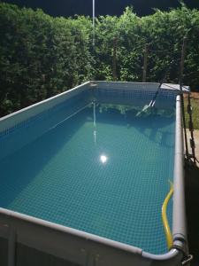 an overhead view of an empty swimming pool at Vila Kabashi in Korçë