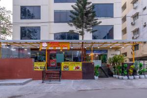 a fast food restaurant in front of a building at ABI RESIDENCY Hitech City in Hyderabad