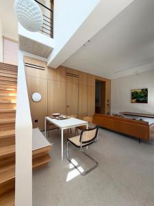 a room with a table and a bed at The Habitus Residence, a Design house in Corfu +51 photos