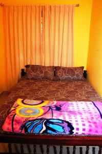 Postel nebo postele na pokoji v ubytování Akashadeepa Homestay