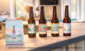four bottles of beer sitting on a counter next to a box at Kyriad Bordeaux - Merignac Aéroport in Mérignac
