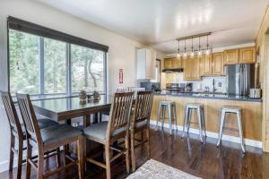 a kitchen with a wooden table and chairs at Orion Ridge Retreat in Stateline