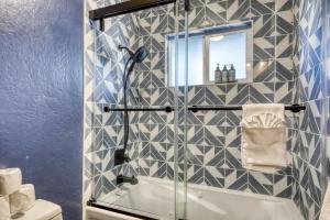 a bathroom with a shower with a glass door at Orion Ridge Retreat in Stateline