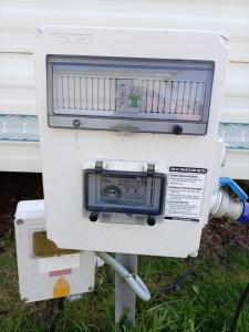 a machine sitting in the grass with a tv on it at Sandgate retreat hemsby 2023 in Hemsby +5 photos