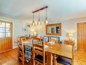 a dining room with a wooden table and chairs at 2 Bed in Morpeth oc-cn049 in Acklington