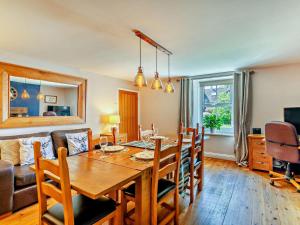 a dining room and living room with a table and chairs at 2 Bed in Morpeth oc-cn049 in Acklington