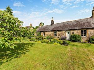 an old stone house with a grass yard at 2 Bed in Morpeth oc-cn049 in Acklington