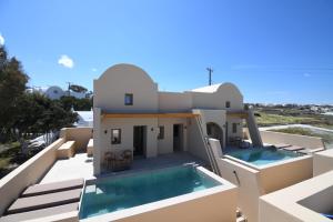 a view of a house with a swimming pool at Santorini - Villa - Sleeps 4 - Pool - Parking in Mesaria