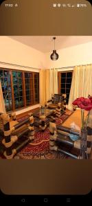 a living room with a couch and a table at Reevilla in Madikeri
