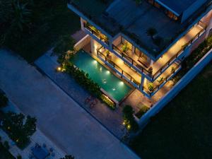 an overhead view of a building with a swimming pool at ArtLua Boutique Hotel Tam Coc in Văn Lâm