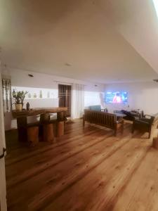 a living room with a couch and a table at Reevilla in Madikeri