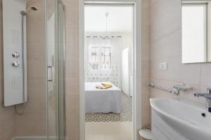 a bathroom with a shower and a table at B&B Li Peticurti in Cerfignano +54 photos