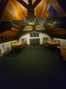 a large room with wooden tables and chairs at Ty Bert in Newport