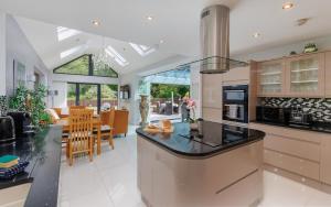 a kitchen with a counter and a dining room at Undercliff View - St Lawrence Retreat in Saint Lawrence