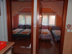 A bed or beds in a room at Marinica Apartman II.