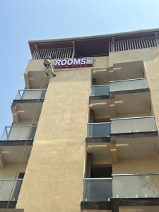 a man hanging from the side of a building at Sri Sai royal suites in Sonda