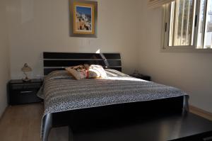 Postel nebo postele na pokoji v ubytování Sunset Garden Villa + 25 fotografií