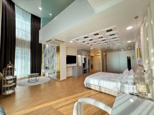a large room with a bed and a television at D Gateway Perdana Hotel Bangi in Bangi