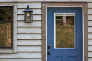a house with a blue door and a window at Blue's Barn in Nellysford +48 photos