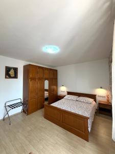 a bedroom with a large bed and two night stands at Tea Rooms in Bale