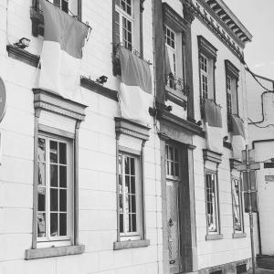 a black and white photo of a building with windows at Désir D'un Soir in Lessines +3 photos