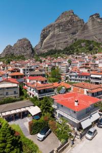 a view of a city with a mountain in the background at Meteora boutique villa E in Kalabaka