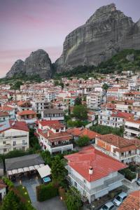 a view of a city with a mountain in the background at Meteora boutique villa A in Kalabaka +54 photos