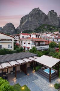 a view of a city with mountains in the background at Meteora boutique villa A in Kalabaka