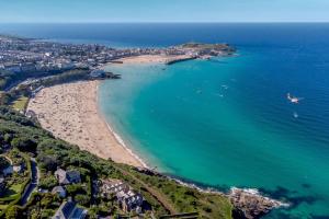 an aerial view of a beach and the ocean at 1 Bed in St. Ives oc-e28023 in St Ives